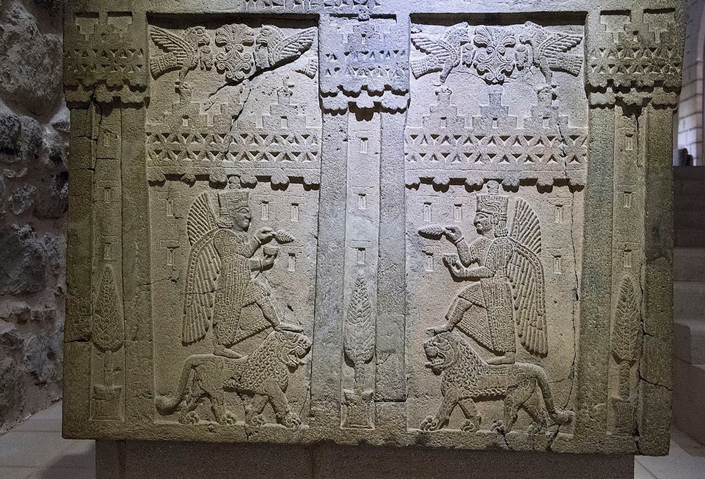 Relief base with inscription. Adilcevaz-Kef Kalesi. Two winged gods standing on lions are facing each other. The figures are identified as Teişeba, the Storm God. 7th century BC. - Urartu was an Iron Age Armenian kingdom famed for one of the finest examples of ancient art. Urartu at its zenith had a profound cultural influence on its neighbors reaching as far as Asia and Europe. Supported by discoveries of Urartian artifacts inside Etruscan burials, it has been hypothesized that much of Etruscan culture has its origins in Urartu.