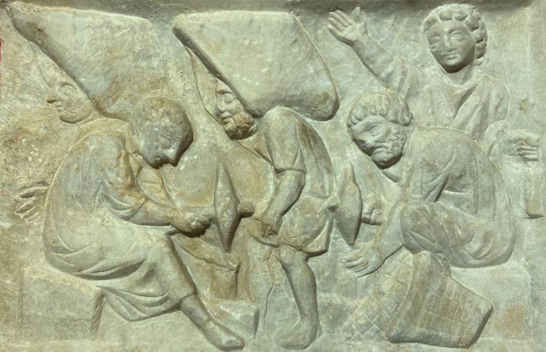 Funerary relief found in the necropolis of Isola Sacra (ancient Ostia, Rome). It was perhaps placed at the end of a locus and is supposed to depict a scene of work with mosaics at work, in memory of the profession of the deceased - Museo della Centrale Montemartini in Rome