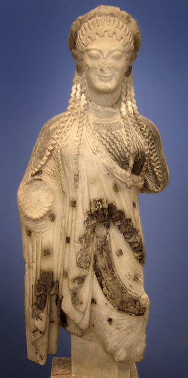 Kore 675 from the Acropolis. The kore was originally brightly paintedand and has a Doric peplos with embroidered motifs (6th century BCE). Museum of the Acropolis, Athens