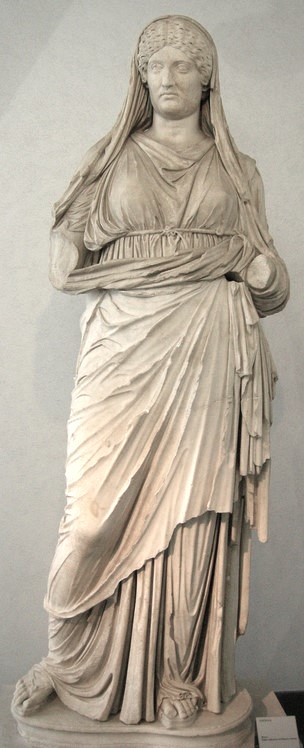 Perhaps it is a statue depicting Lucilla. The matron wears a stole and ball. Marble statue from Palazzo Sciarra, inventoried after 1900. Today it is at the Museo Nazionale Romano, Rome