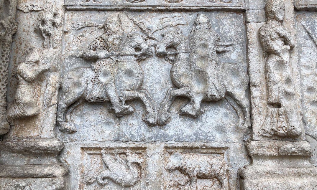 A relief depicting the duel between Theodoric and Odoacer, king of the Heruli - 12th century, Basilica of San Zeno in Verona. It is located on the sides of the protiro, on the left side.